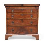 An English walnut bachelors chest, in the George I style, first quarter 20th century, stamped Mui...