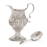 A George III silver cream jug, London, 1775, Ann Smith & Nathaniel Appleton, of baluster form wit...