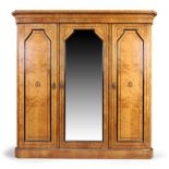 A Victorian Aesthetic movement burr oak triple wardrobe, last quarter 19th century, ebony and box...