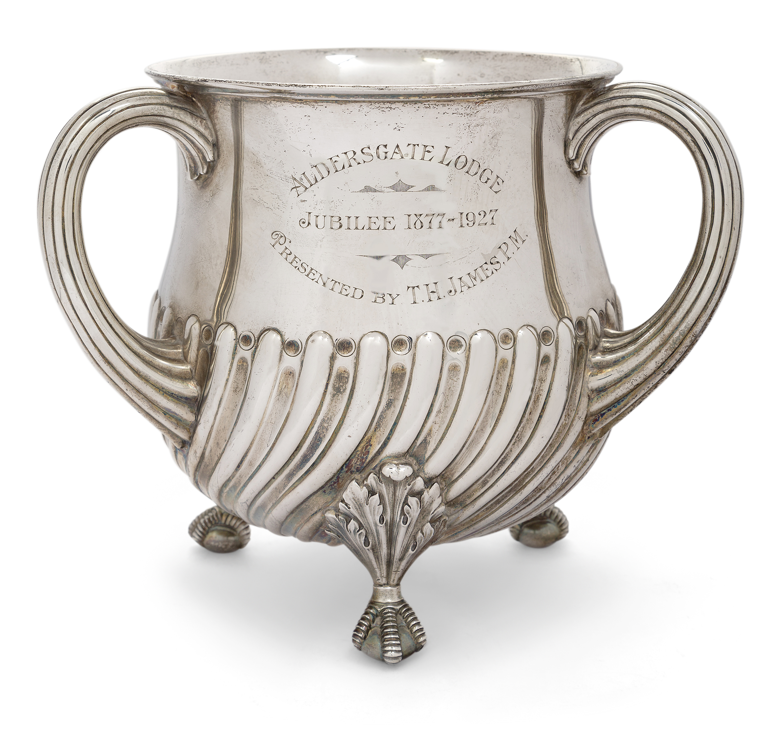 A large Victorian silver presentation tyg, London, 1890, Walter & John Barnard, raised on four ba...