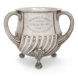 A large Victorian silver presentation tyg, London, 1890, Walter & John Barnard, raised on four ba...