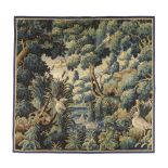 A Flemish verdure tapestry fragment, 17th century, depicting a central lake with bull rushes, sur...