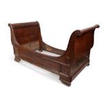 A French mahogany bateau lit, 19th century, with scroll ends and mouldings, 112cm high, 210cm wid...