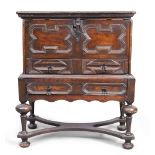 A Charles II oak chest on stand, last quarter 17th century, the hinged top above two drawers, wit...