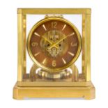 A Jaeger-LeCoultre Atmos clock, c.1950s, with brushed brass case, the circular chapter ring with ...