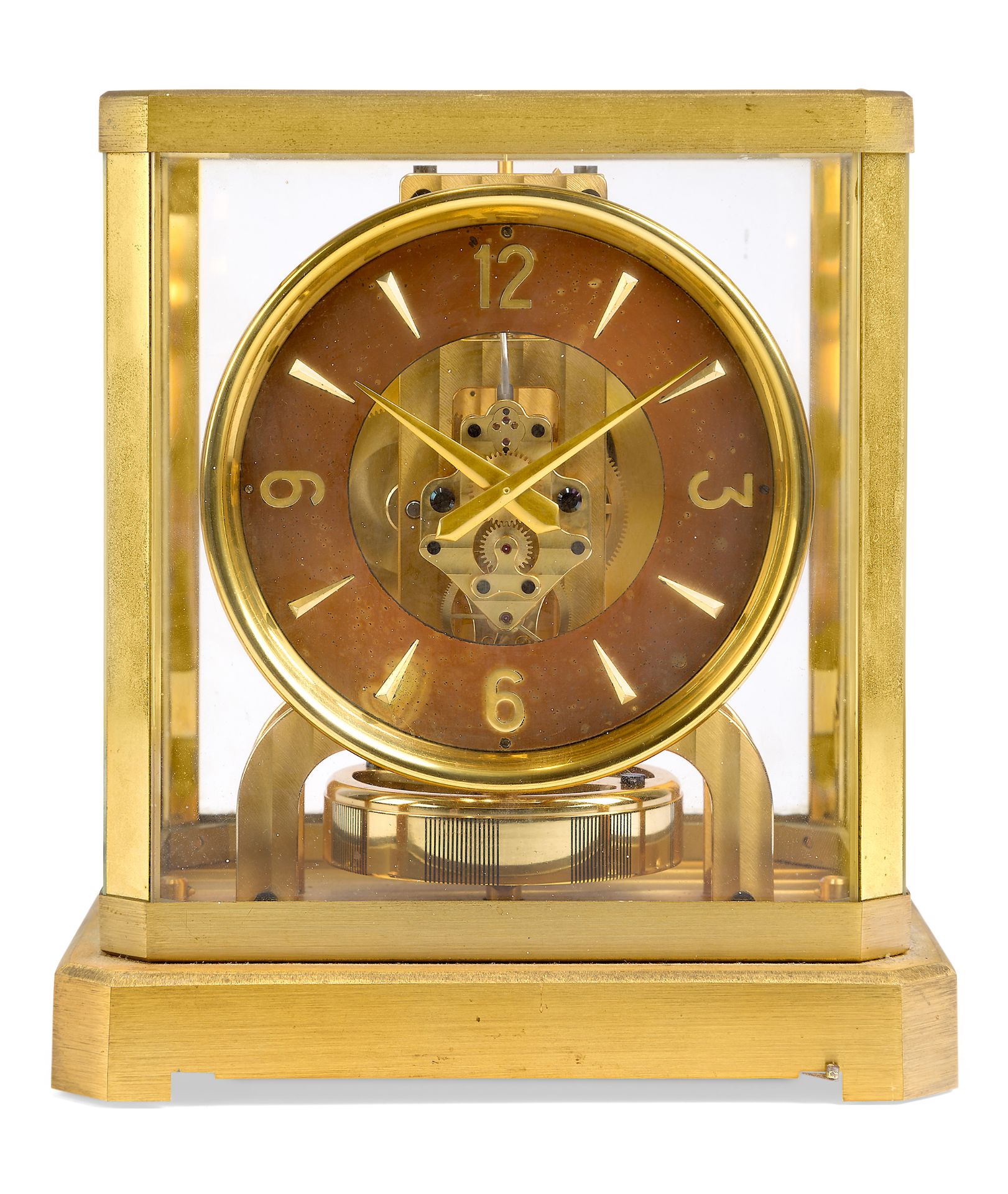 A Jaeger-LeCoultre Atmos clock, c.1950s, with brushed brass case, the circular chapter ring with ...