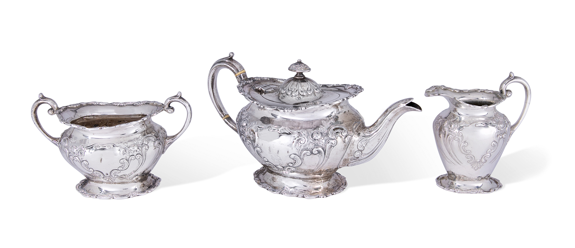 A Scottish silver three piece bachelor's tea set, Glasgow, 1904, George Edward & Sons, the oval r...