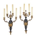 A pair of French gilt and patinated bronze four-light figural wall appliques, of Empire style, se...