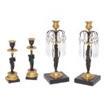 Two Regency gilt and patinated bronze lustre candlesticks, parts early 19th century, each with mo...