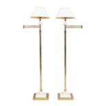 A pair of brass and porcelain adjustable reading lamps by Mangani, 20th century, 140cm high (2) ...