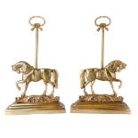 A pair of Victorian brass door stops, late 19th century, each cast with a horse below rope twist ...