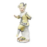 A Meissen figure of a boy, c.1755-60, traces of blue crossed swords mark and impressed C to back ...