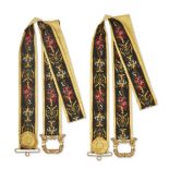 A pair of French embroidered and silk bell pulls, early 20th century, worked in various colours w...