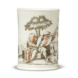 A Vienna (du Paquier) porcelain small Wermuth beer tankard, c.1730-40, painted en grisaille and e...