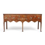 A George III oak dresser base, last quarter 18th century, the crossbanded top above five drawers,...
