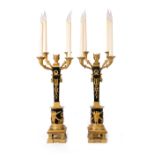 A pair of French gilt and patinated bronze four light candelabra, of Empire style, late 19th / ea...