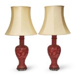 A pair of Chinese red cinnabar-lacquer-style baluster table lamps, mid-20th century, of baluster ...