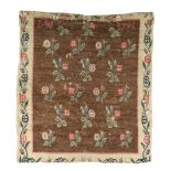 An English tapestry fragment, last quarter 18th century, the central field with floral motifs, in...