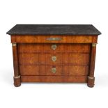 An Empire figured mahogany commode, second quarter 19th century, gilt metal mounted, the black ma...