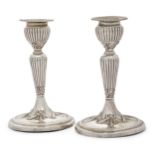 A pair of Edwardian silver tapersticks, Birmingham, 1906, Joseph Gloster, with ribbon garland det...