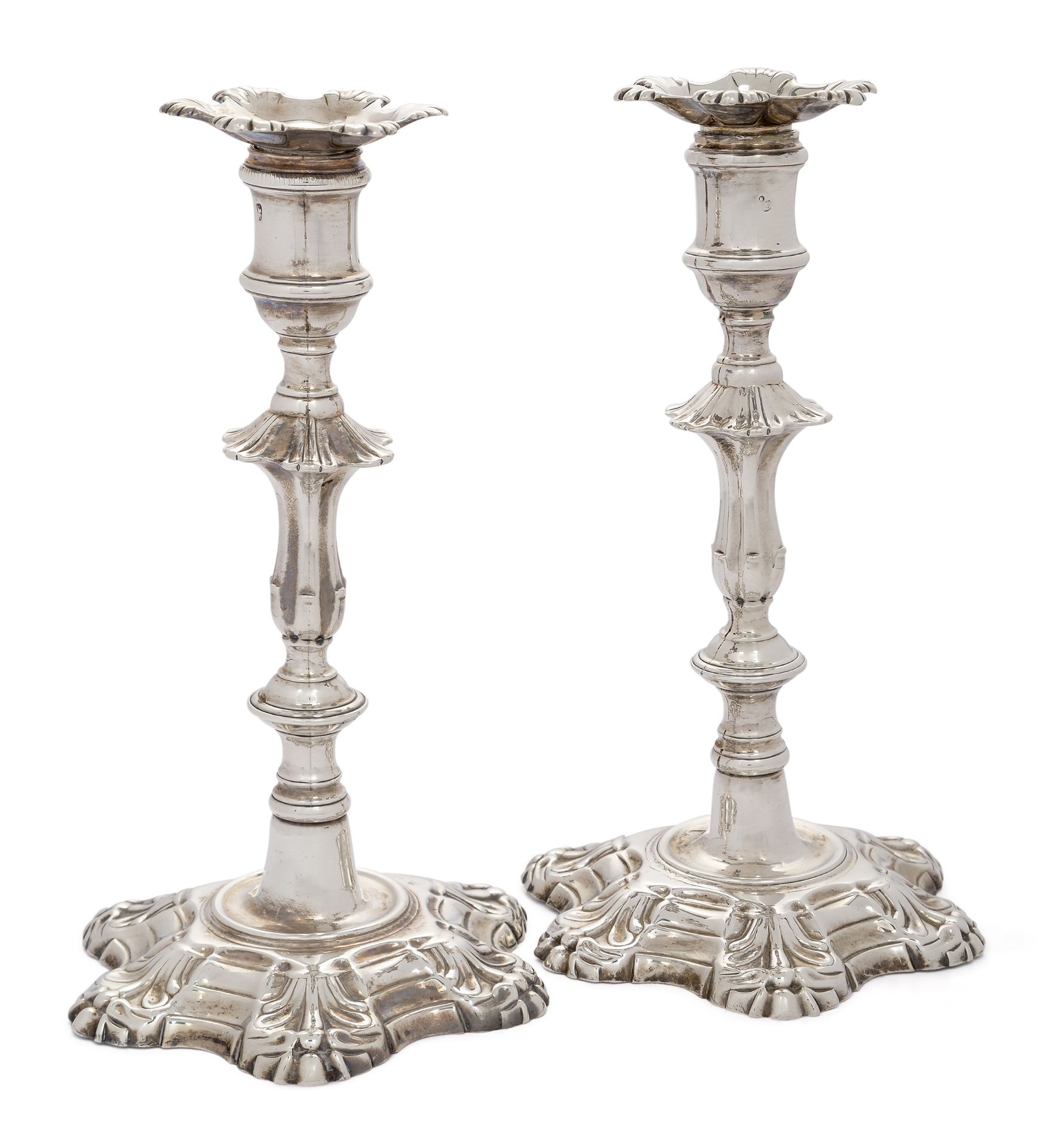 A pair of early George III silver candlesticks, London, 1762, William Cafe, the knopped stems wit...