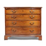 A George III mahogany serpentine chest, last quarter 18th century, with brushing slide above four...