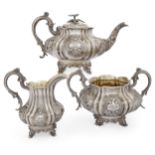 A Victorian three piece silver tea set, London, 1840, John & Henry Lias, of lobed, compressed for...