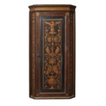 A Continental mahogany corner violin cabinet, early 20th century, decorated with eagles, lion mas...