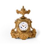 A French gilt-bronze mantel clock, mid-19th century, the case with truncated column flanked by sc...