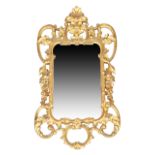 An English giltwood mirror, George III style, last quarter 19th century, the carved and pierced f...