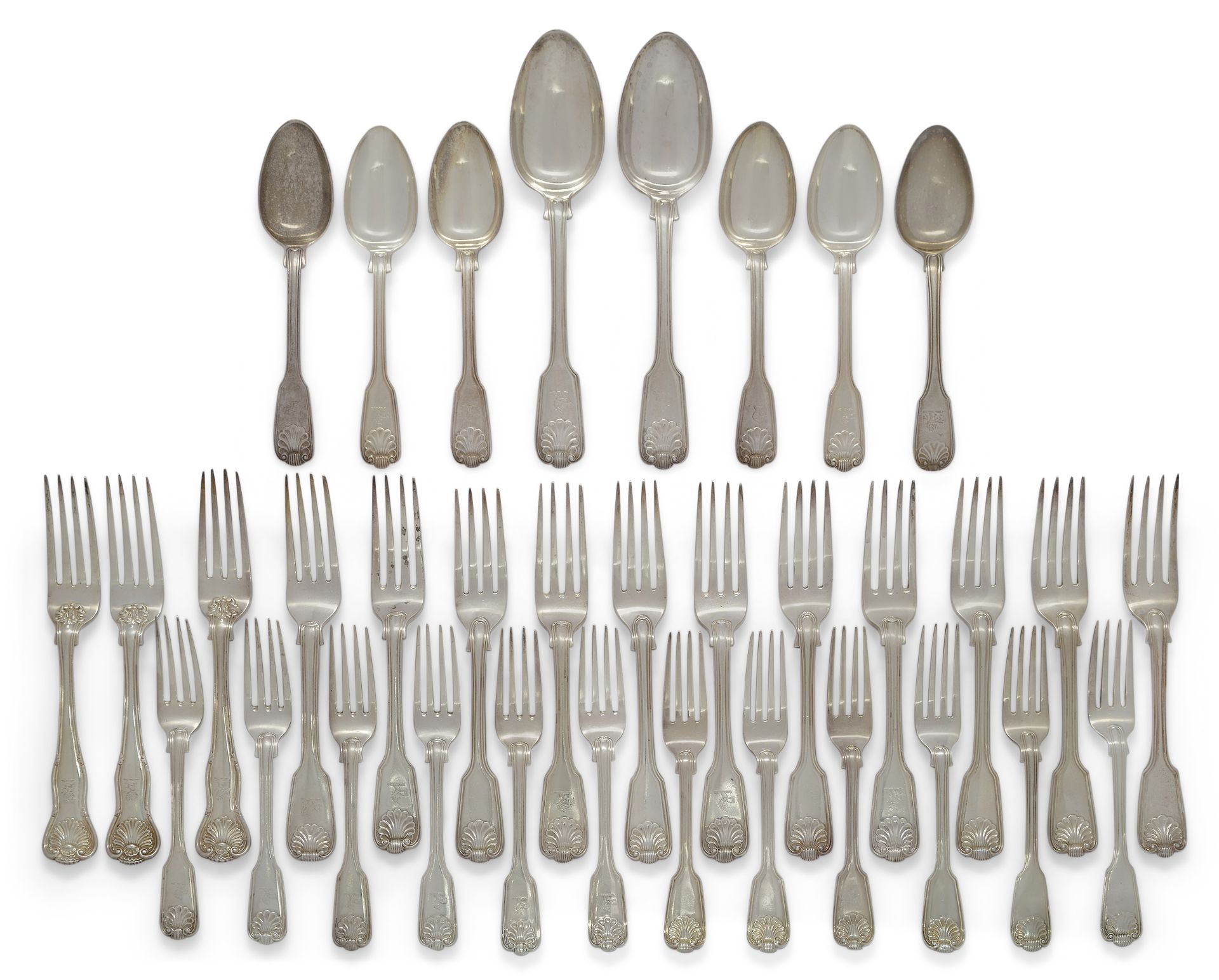 A quantity of silver flatware comprising: a group of William IV Fiddle, Thread and Shell flatware...