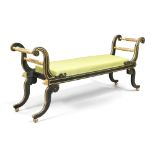 A Regency window seat, first quarter 19th century, painted in green and gilt, with scrolling ends...