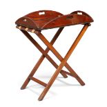 An oval mahogany butlers tray, first quarter 19th century, with brass fittings, on folding stand,...