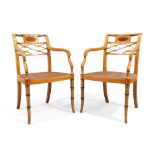 A pair of English inlaid satinwood armchairs, in Sheraton style, 20th century, polychrome painted...