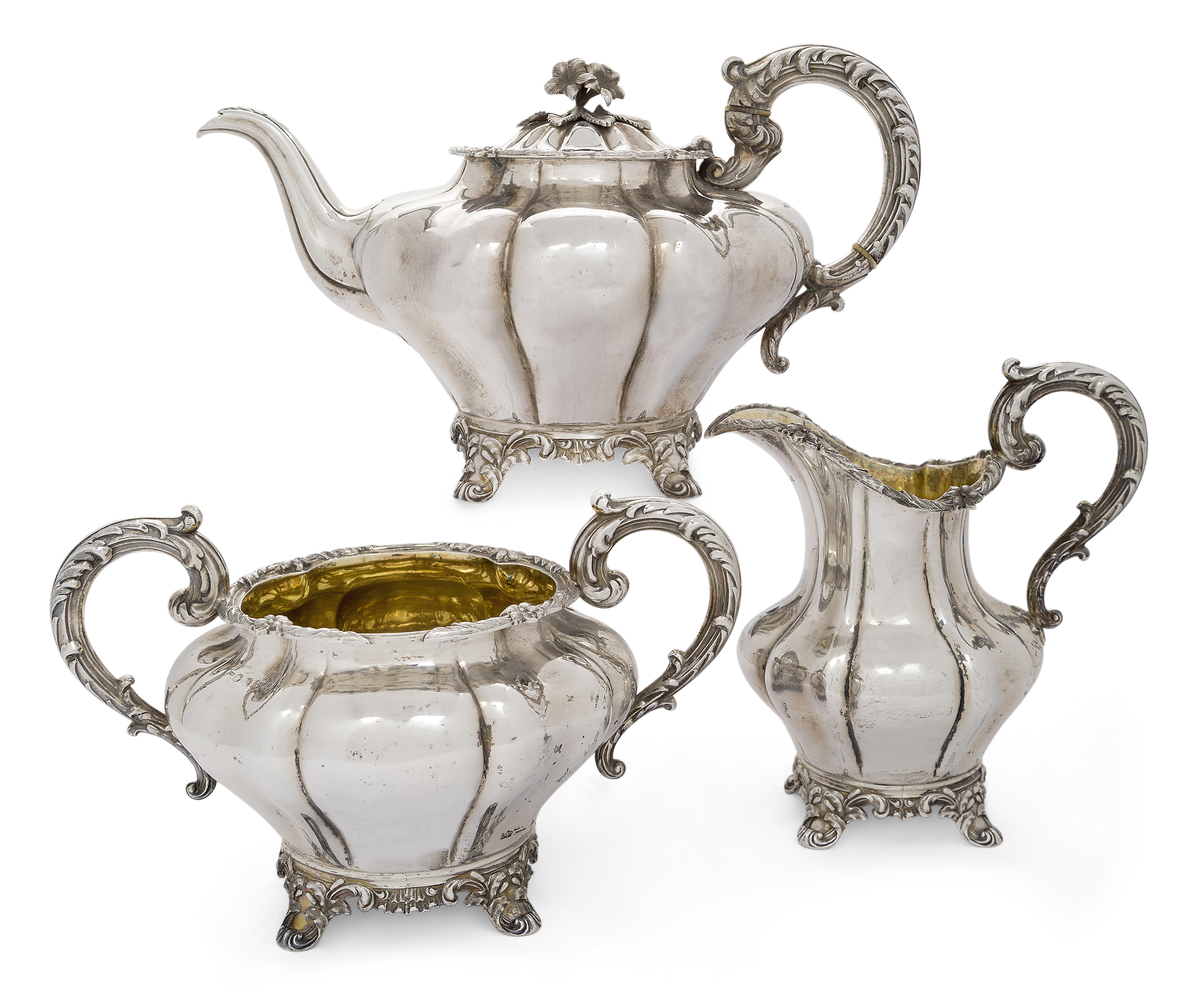 A Victorian three piece silver tea set, Newcastle, 1840, John Walton, the melon-shaped teapot, su...