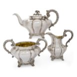 A Victorian three piece silver tea set, Newcastle, 1840, John Walton, the melon-shaped teapot, su...