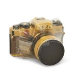 A Leica R4 35mm SLR camera, 1984, gold plated and faux snake skin, no. 1652044, special serial no...