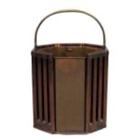 A George III mahogany plate bucket, last quarter 18th century, with slatted sides, brass handle a...