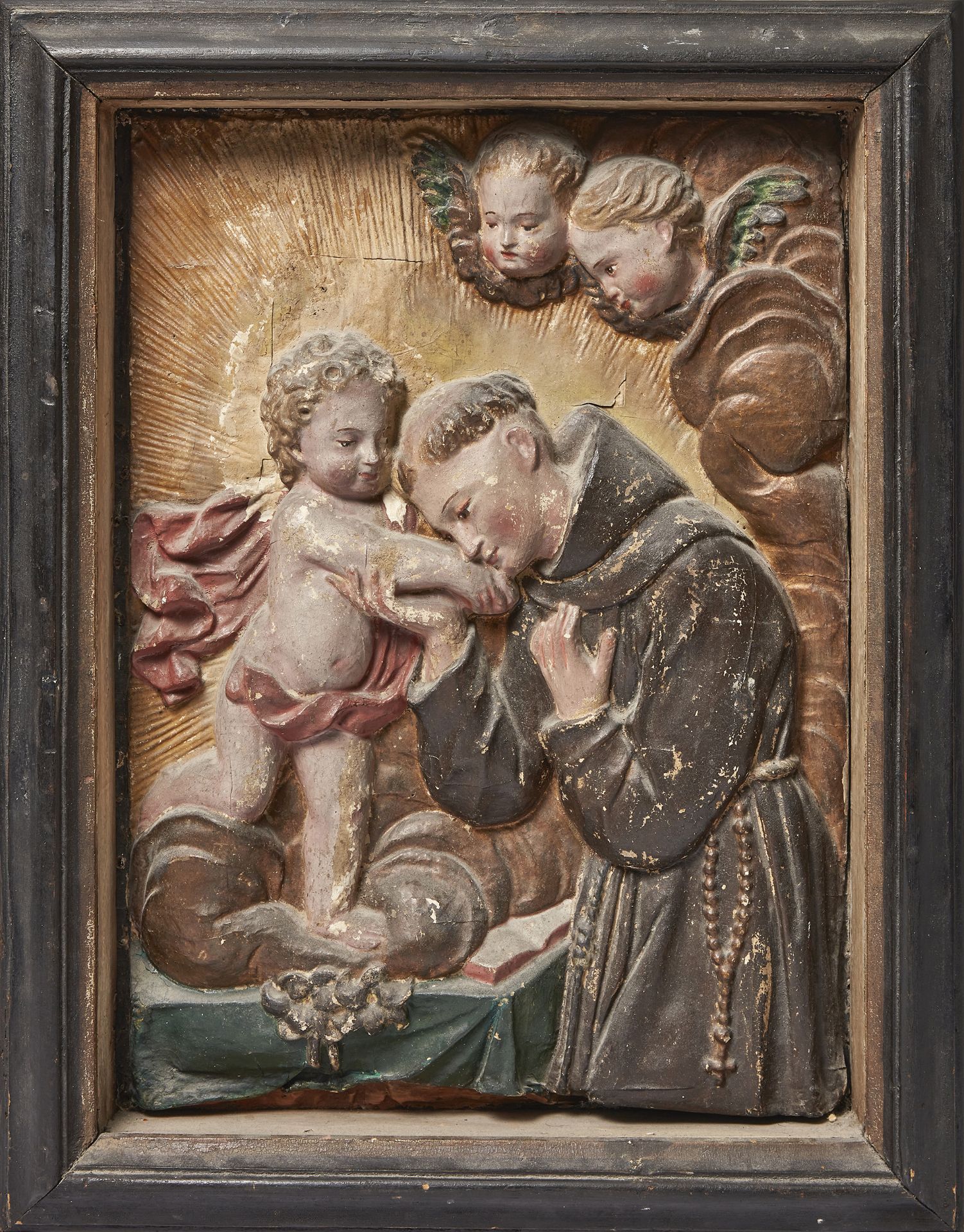 An Italian relief paper panel of Saint Anthony of Padua, late 19th century, with the Christ Child...