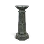 A green serpentine marble pedestal column, first quarter 20th century, ring turned, raised on oct...