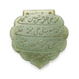 A jade lobed calligraphic pendant (haldili), India, 17th-18th century, inscribed with four lines ...