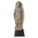 A large grey schist of a standing bodhisattva, Gandhara, superbly carved in the round standing on...
