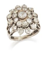 A diamond set oval cluster ring, the central brilliant-cut diamond to two row surround of brillia...