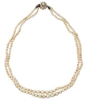A two row natural pearl necklace, two rows of graduated natural pearls, strung knotted, to a gold...