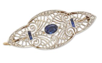 A diamond and sapphire quatrefoil brooch/pendant, the central oval sapphire to openwork millegrai...