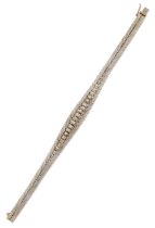 An 18ct white gold diamond set bracelet, of tapering form, with a row of graduated Swiss-cut and ...