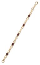 A 9ct gold garnet bracelet, a series of oval cabochon garnets, collet set, with elongated and sti...
