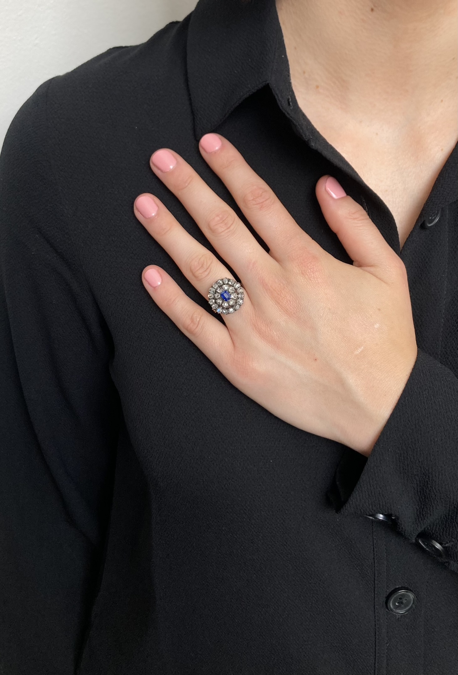 A late 19th century sapphire and diamond cluster ring, the cushion cut sapphire to double row ros... - Image 2 of 2