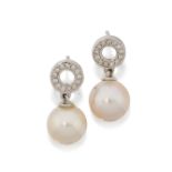 A pair of cultured freshwater pearl and diamond earrings, the cultured freshwater pearl surmounte...