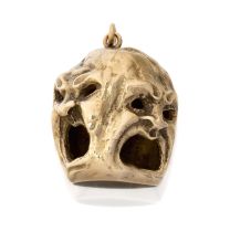 A screaming mask pendant,